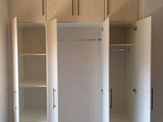 Beech wood grain built in cupboards 