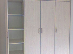 Beech wood grain built in cupboards 