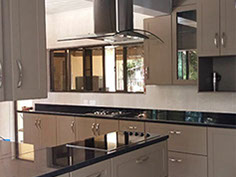 Light wood grain kitchen with granite tops 